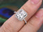 1.50 Carat Emerald Cut Moissanite and Diamond Halo Engagement Ring in 9k White Gold