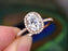 1.50 Carat Oval Cut Moissanite and Diamond Halo Engagement Ring in 9k Rose Gold