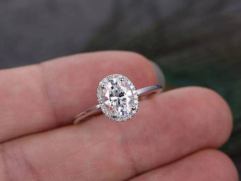 1.25 Carat Oval Cut Moissanite and Diamond Halo Engagement Ring in White Gold