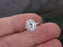 1.25 Carat Oval Cut Moissanite and Diamond Halo Engagement Ring in White Gold