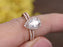 2 Carat Pear Cut Moissanite and Diamond Halo Wedding Set in Rose Gold
