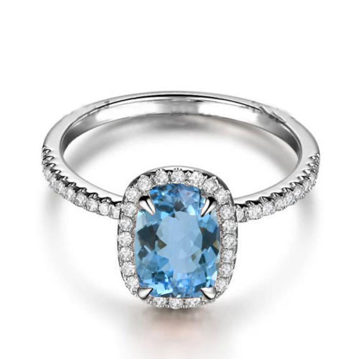 1.50 Carat oval cut Aquamarine and Diamond Halo Engagement Ring in White Gold