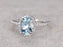 1.50 Carat oval cut Aquamarine and Diamond Halo Engagement Ring in White Gold