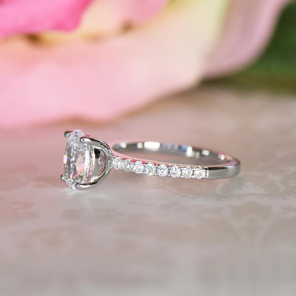 1.25 Carat Oval Cut Accented Engagement Ring in White Gold over Sterling Silver