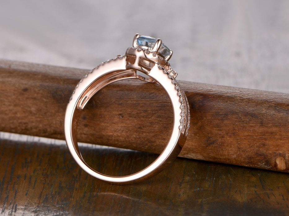 Split shank 1.50 Carat Aquamarine and Diamond Halo Engagement Ring in Rose Gold