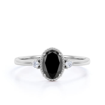 1.50 Carat Vintage Oval Cut Black Diamond and White Diamond Milgrain 3 Stone Engagement Ring in White Gold