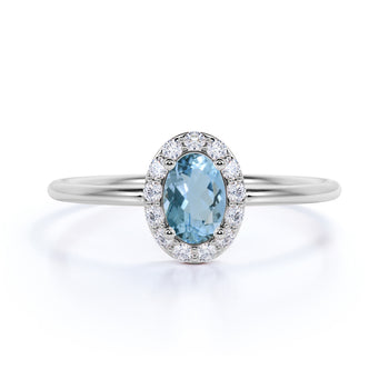 Classic 0.48 Carat  Halo Set Oval Cut Aquamarine and Diamond Dainty Ring in White Gold