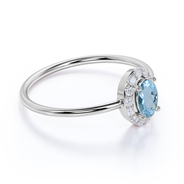 Classic 0.48 Carat  Halo Set Oval Cut Aquamarine and Diamond Dainty Ring in White Gold