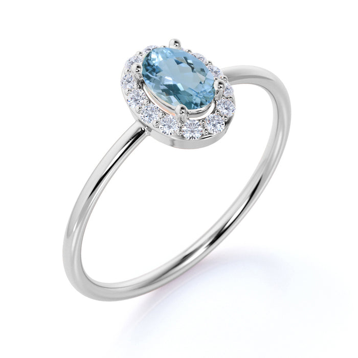 Classic 0.48 Carat  Halo Set Oval Cut Aquamarine and Diamond Dainty Ring in White Gold