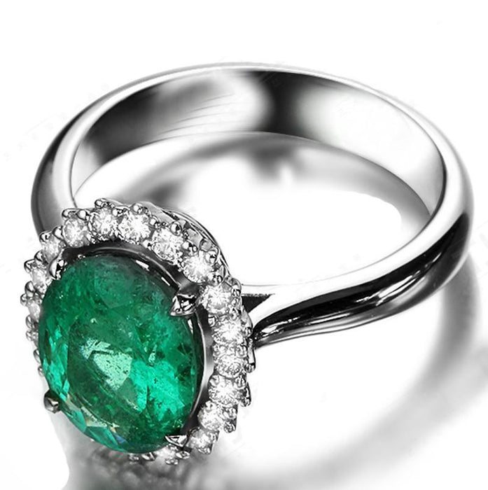 Beautiful 1.50 Carat oval shape Emerald and Diamond Halo Engagement Ring