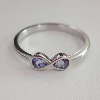 1 Carat Pear Shaped Tanzanite Infinity Design Engagement Rings in White Gold