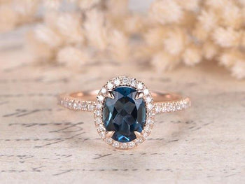 1.50 Carat Oval London Blue Topaz and Diamond Halo Claw Prong Engagement Ring in Rose Gold