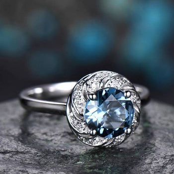 1.25 Carat Round Blue Topaz and Diamond Art Deco Solitaire Engagement Ring in White Gold