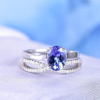 1.50 Carat Oval Cut Tanzanite and Diamond Infinity Design Wedding Ring Set in White Gold