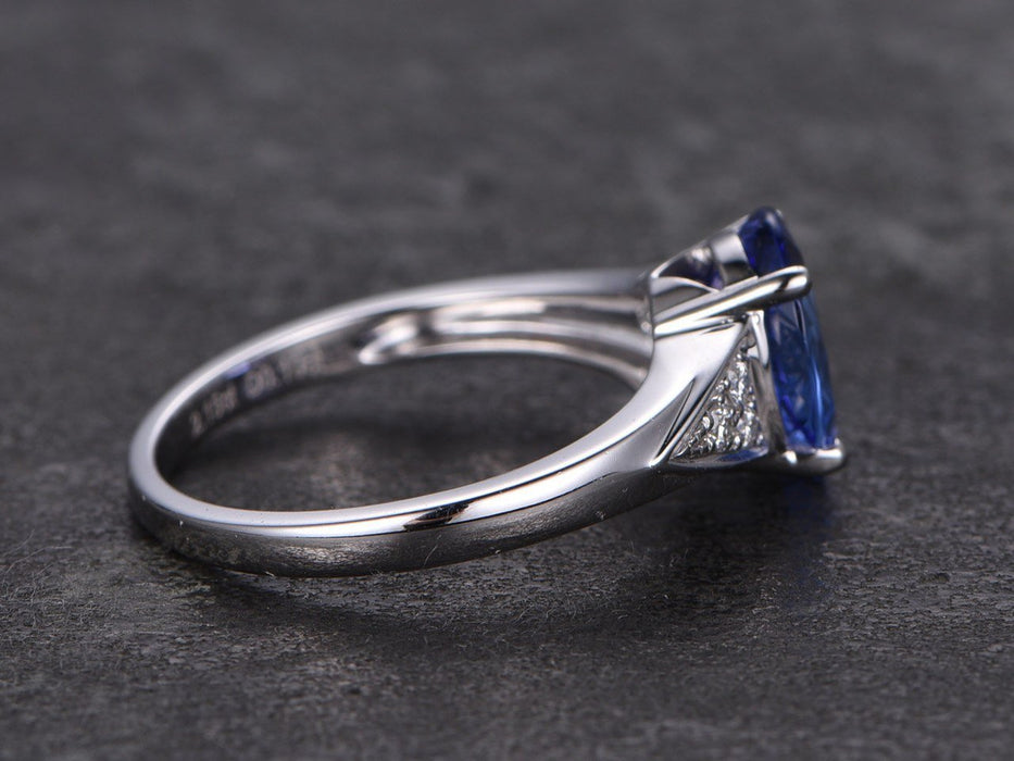 1.25 Carat Oval Cut Tanzanite with Round Cut Diamonds Engagement Ring in White Gold