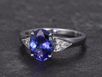 1.25 Carat Oval Cut Tanzanite with Round Cut Diamonds Engagement Ring in White Gold