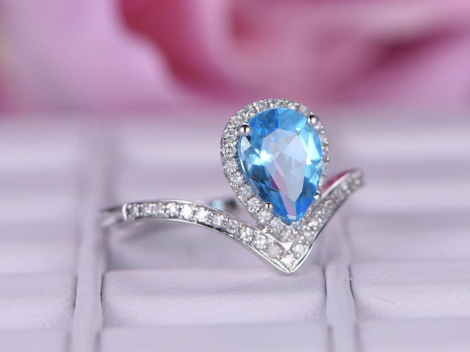 1.25 Carat Pear Cut Sky Topaz and Diamond Unique Curved Engagement Ring in White Gold