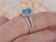 1.50 Carat Oval Cut Sky Blue Topaz and Diamond Halo Claw Prong Split Shank Engagement Ring in White Gold