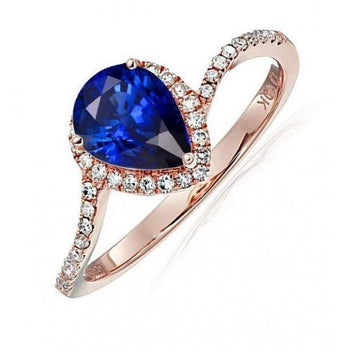 Limited Time Sale: 1.25 Carat Pear Cut Blue Sapphire and Diamond Engagement Ring