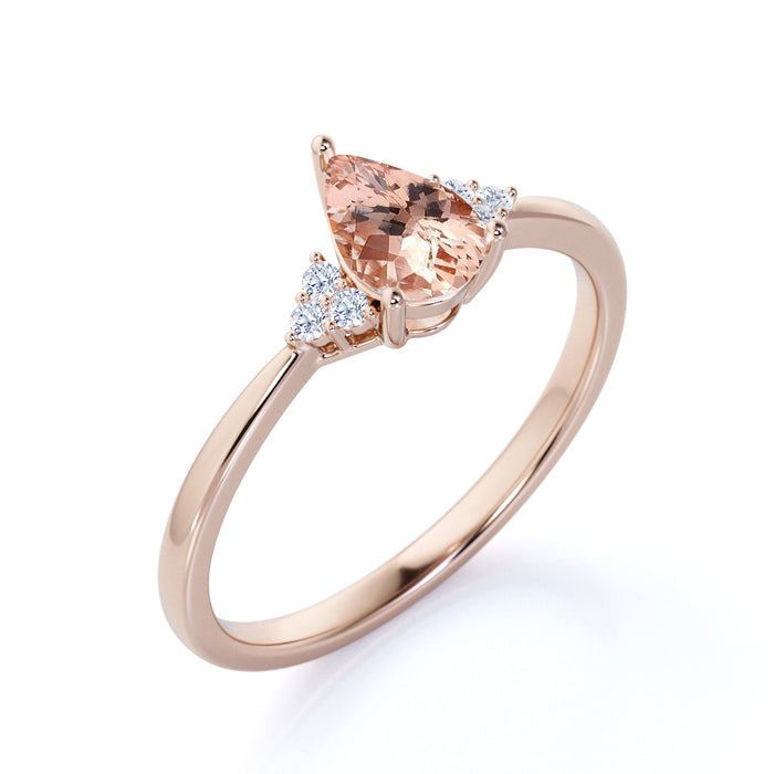 1.50 Carat Pear Shaped Pink Morganite with Diamond Shoulder Accents Cluster Wedding Ring in Rose Gold