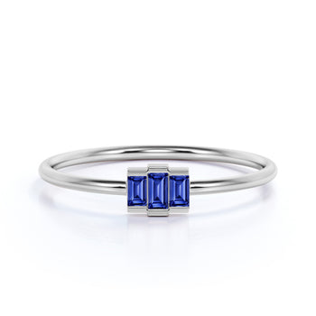 0.56 Carat Dainty Emerald Cut Sapphire Trilogy Ring in White Gold